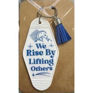 We Rise By Lifting Others White & Blue Tassel Vintage Hotel Motel Keychain